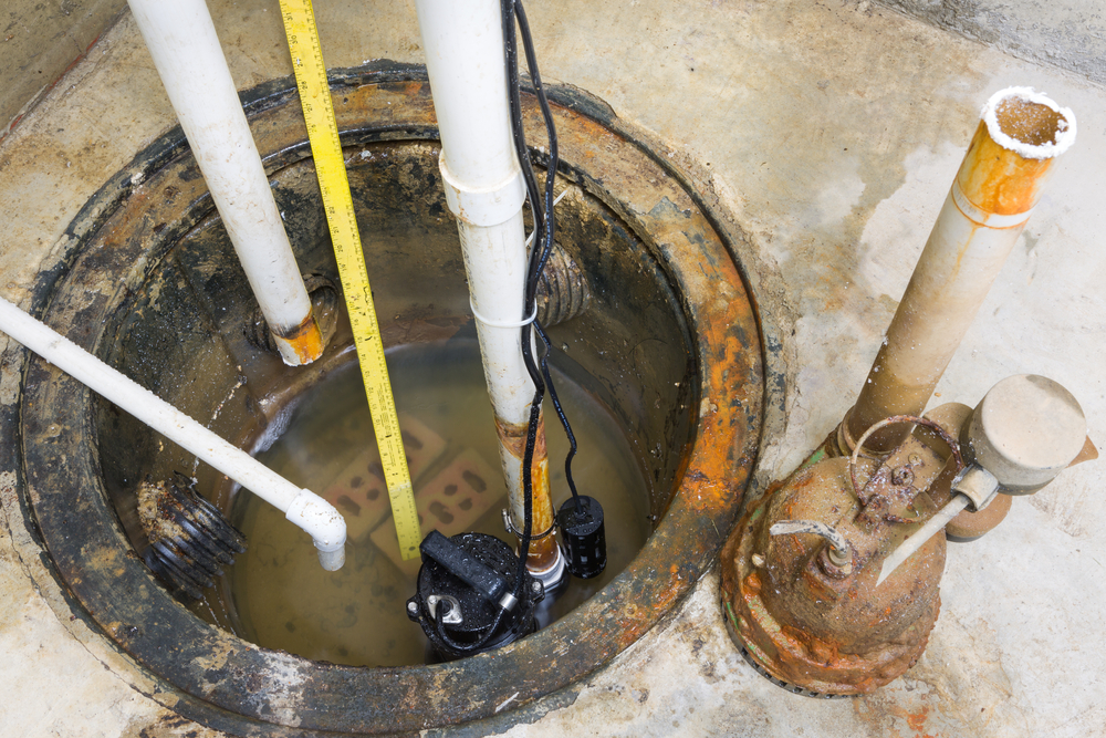 Our plumbing experts performing a sump pump installation in Toronto, ON
