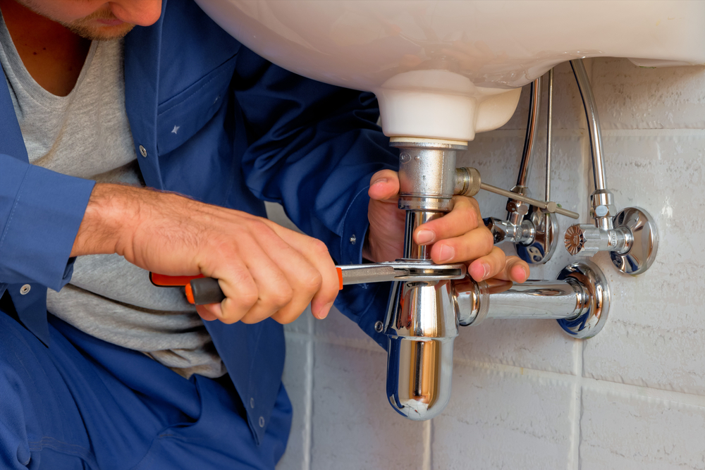 One of our expert plumbers doing plumbing maintenance in Toronto, ON