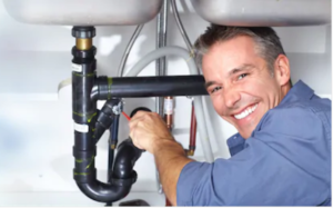 Plumber engaged in drain service